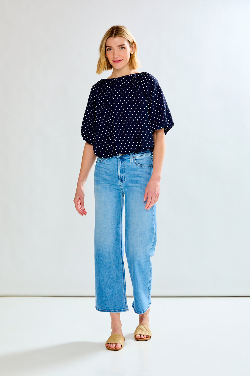 woman with polkadot shirt and jeans