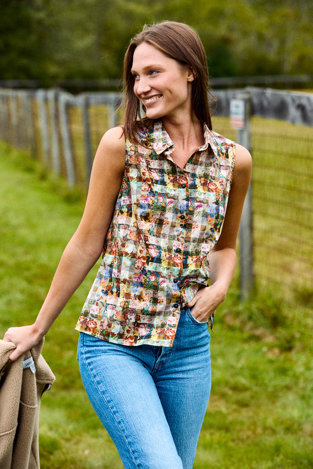 Woman wearing a floral and gingham blouse