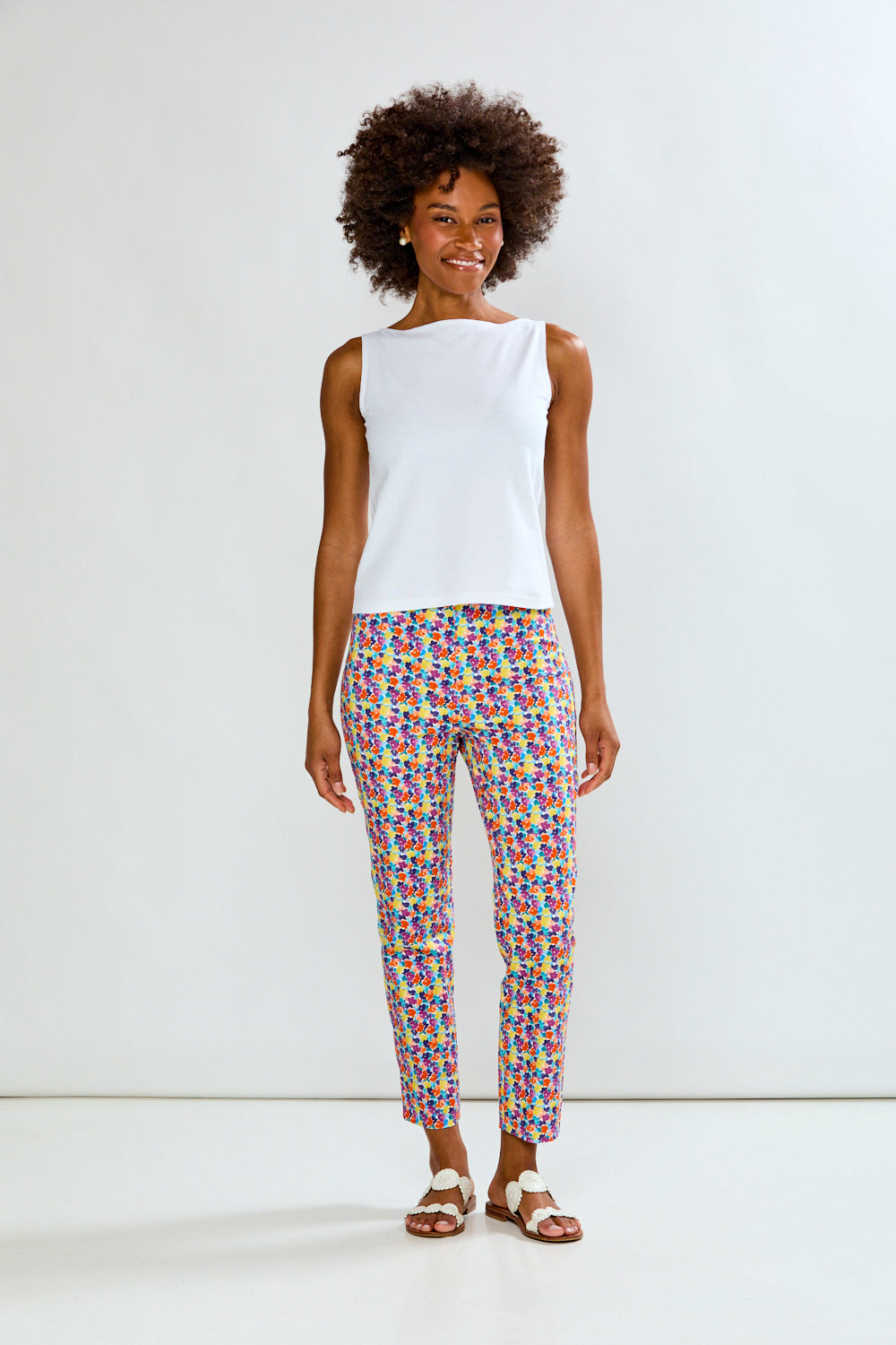 Woman in solid top and printed pants