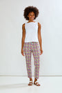 Woman in solid top and printed pants