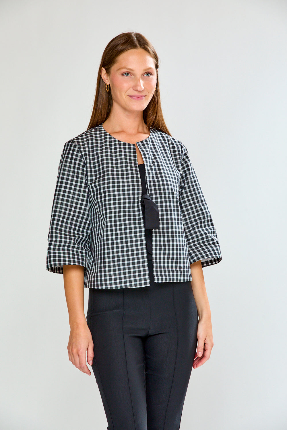 Woman wearing The Aurora Jacket in Check