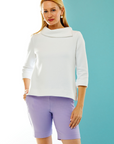 woman in white pullover with asymmetrical collar