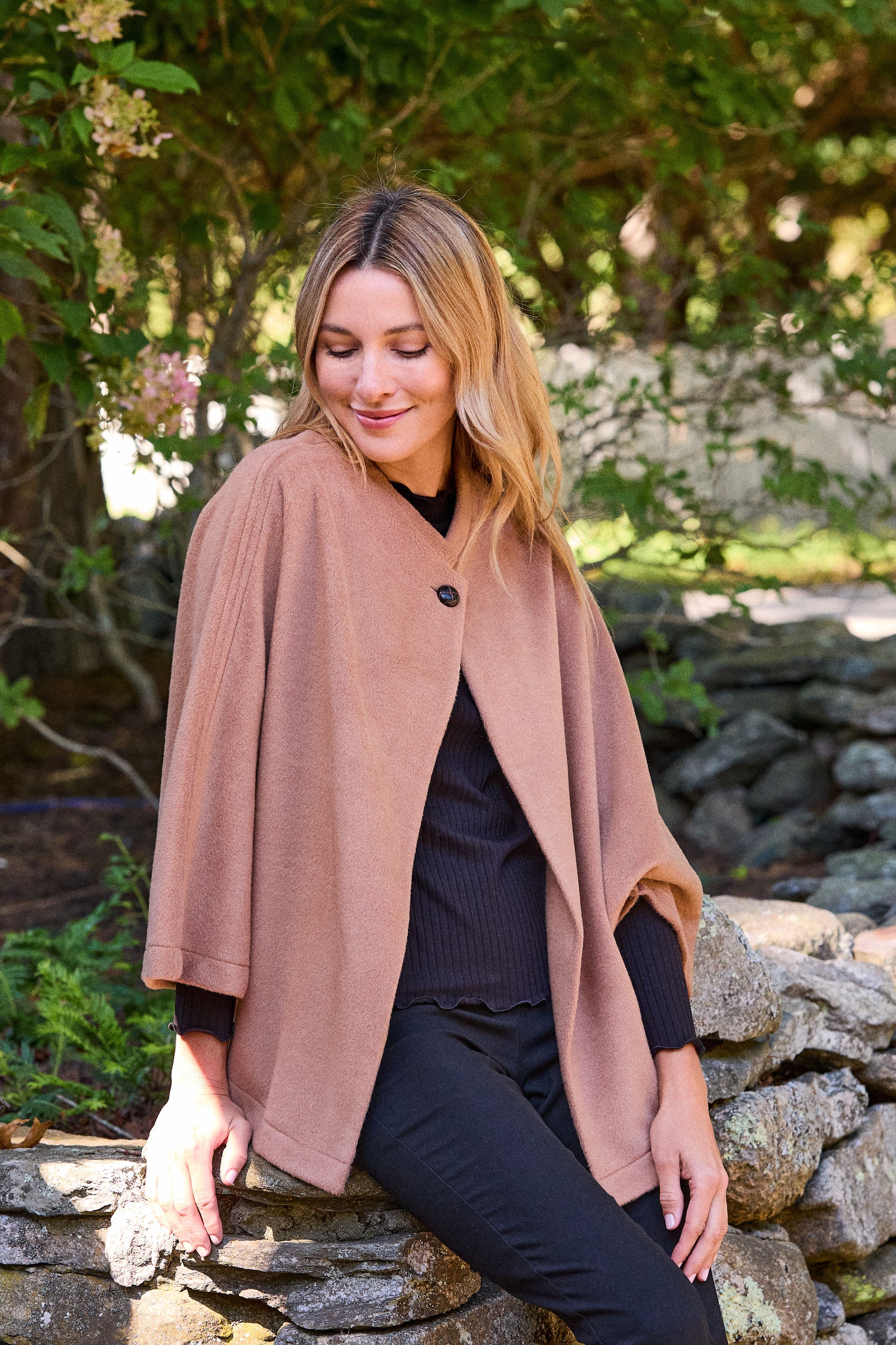 woman with black shirt and brown cape