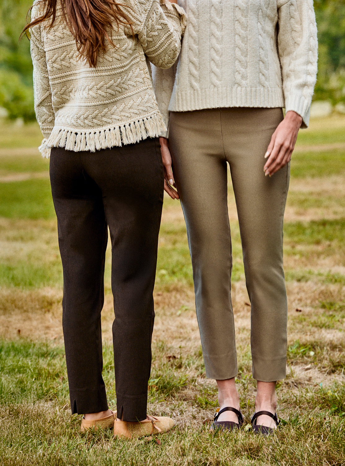 Two women wearing brown pants