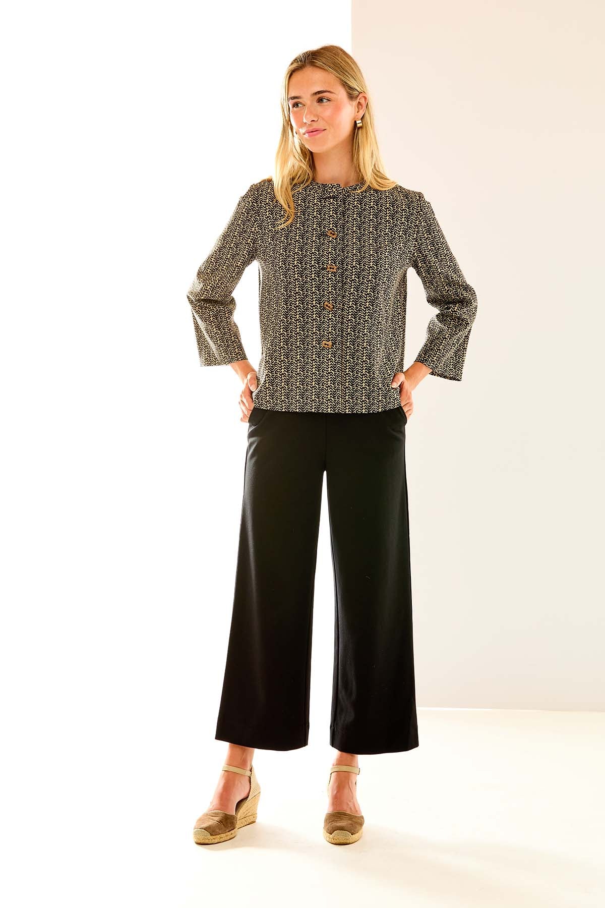 Woman in black wide leg pant