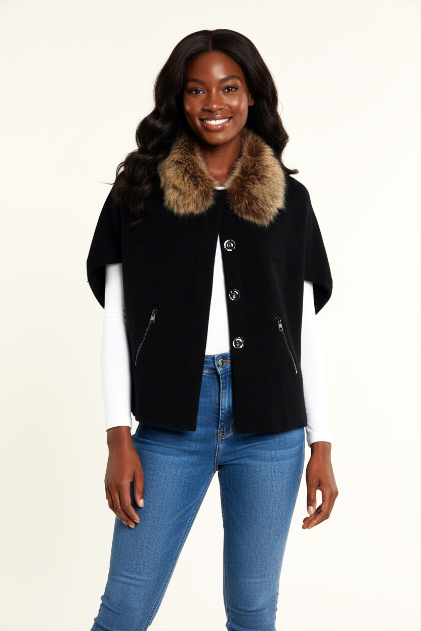 Woman wearing a black jacket with a fur collar and blue jeans on a beige background