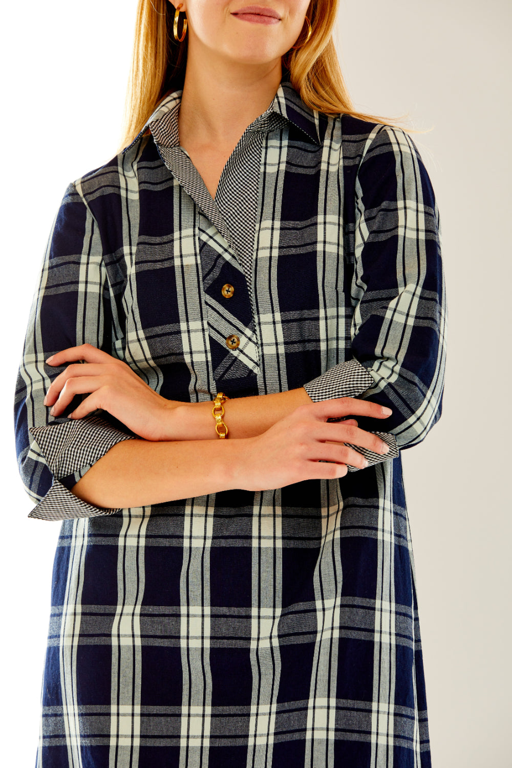 Woman in plaid dress