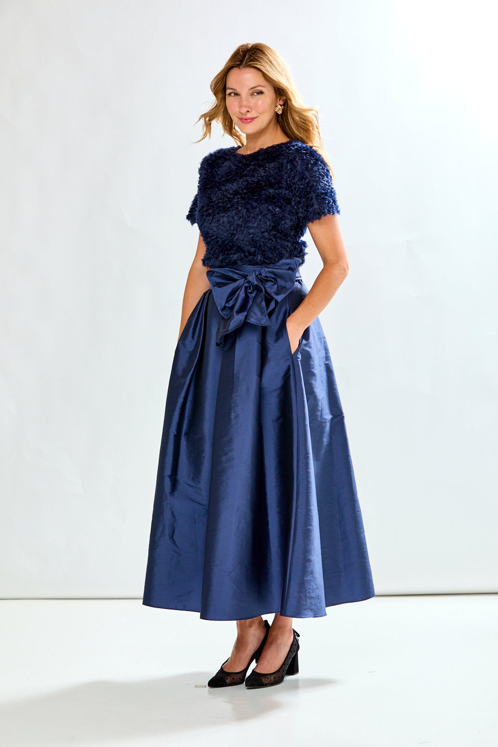 Woman wearing navy taffeta skirt