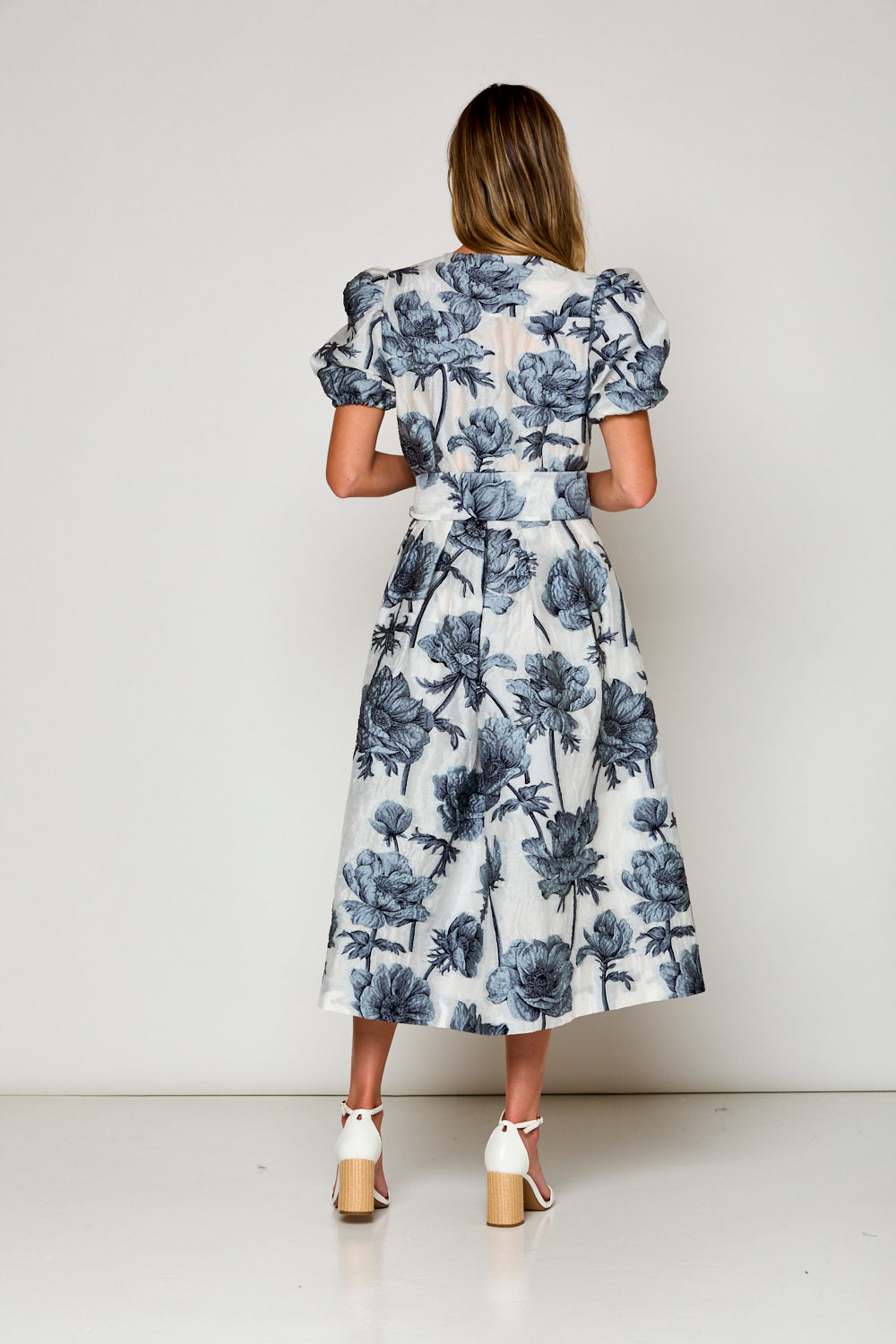 Woman in blue floral dress