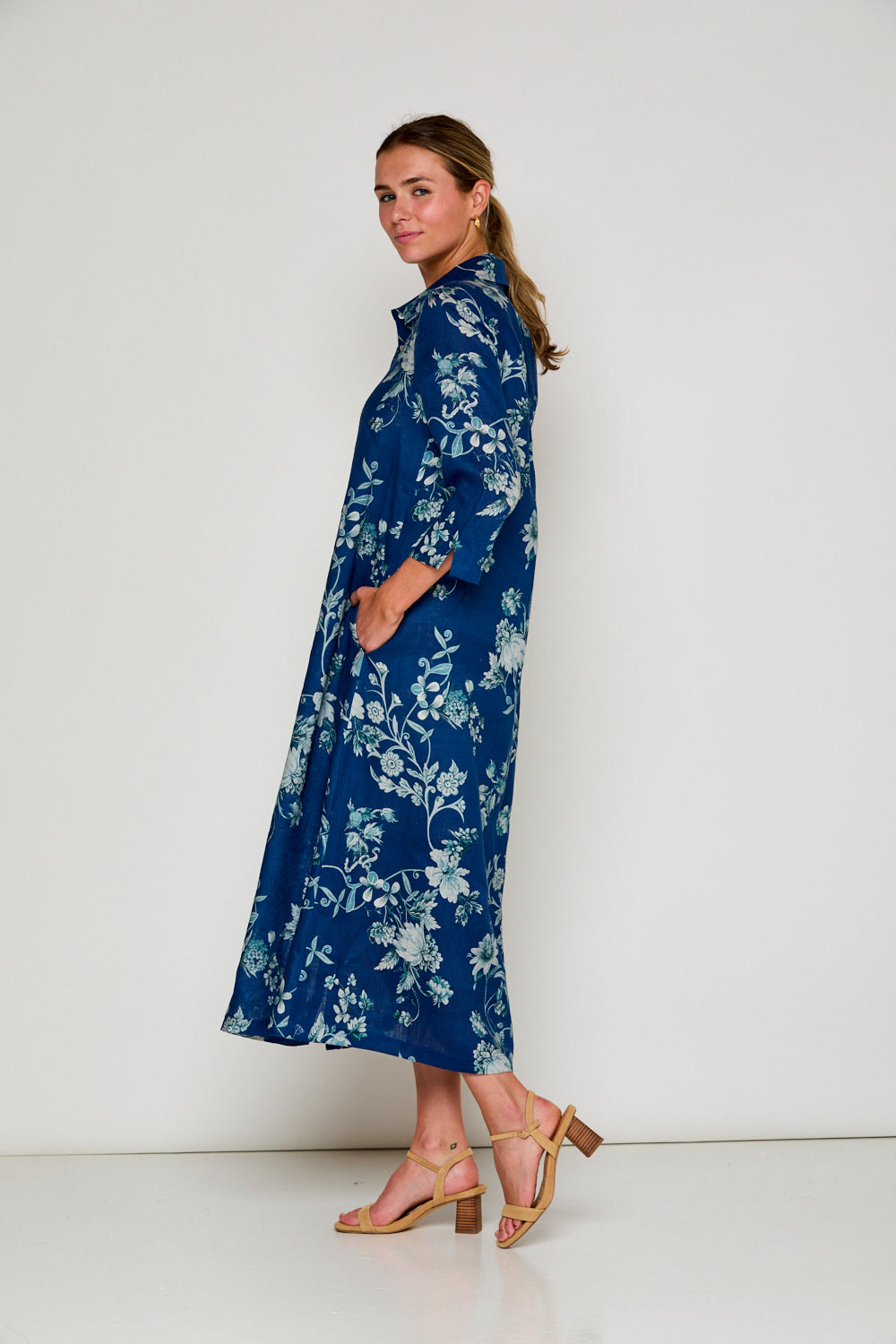 Woman in navy floral dress