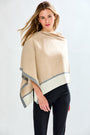 Woman in sand tipped poncho