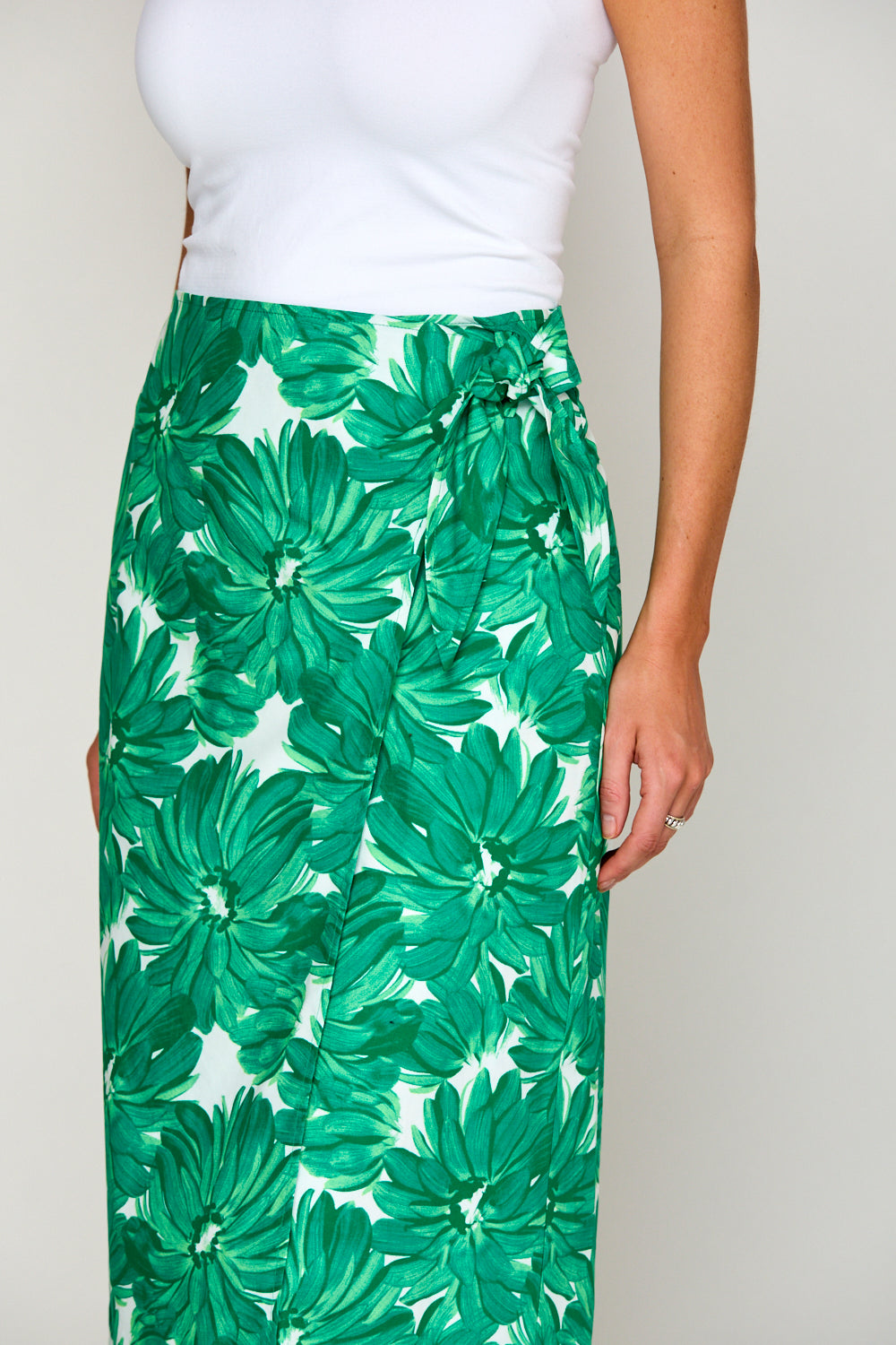 Woman in tropical print skirt