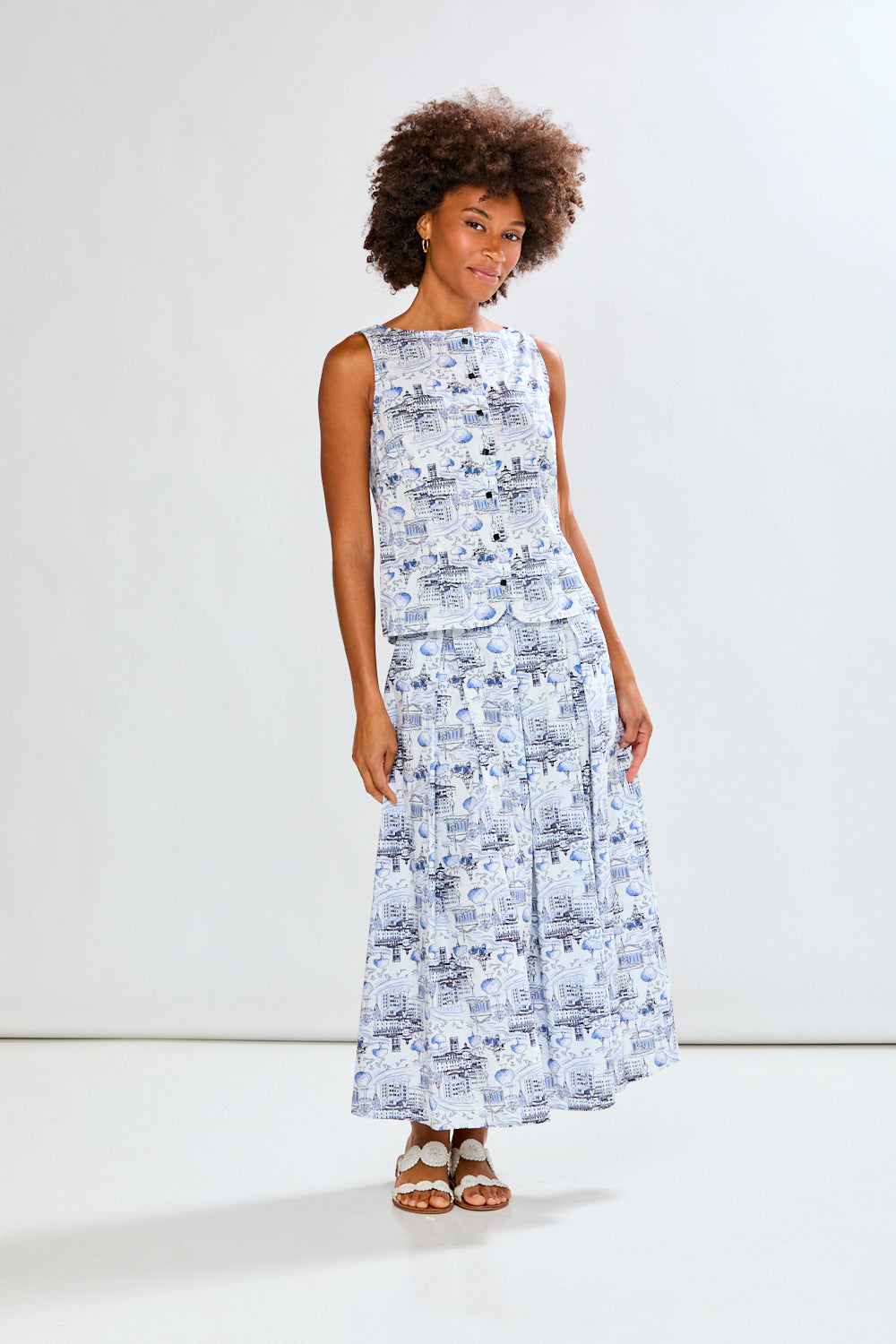 Woman wearing a blue patterned skirt and matching top