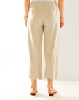 Woman in oatmeal pant with scallop hem