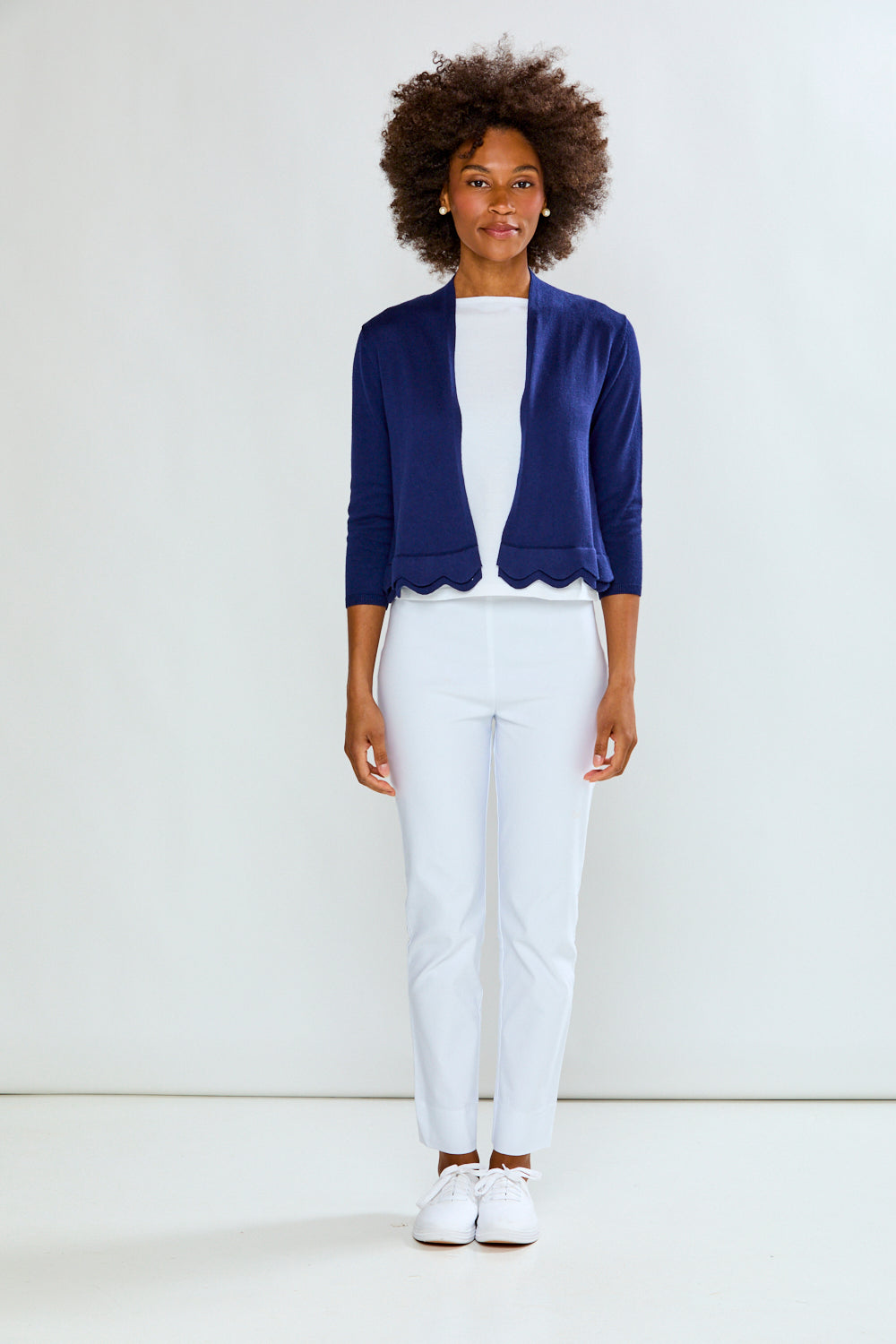 Woman wearing The New Scallop Cardigan - Navy