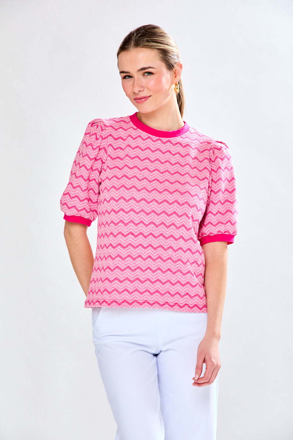 Woman in pink chevron top