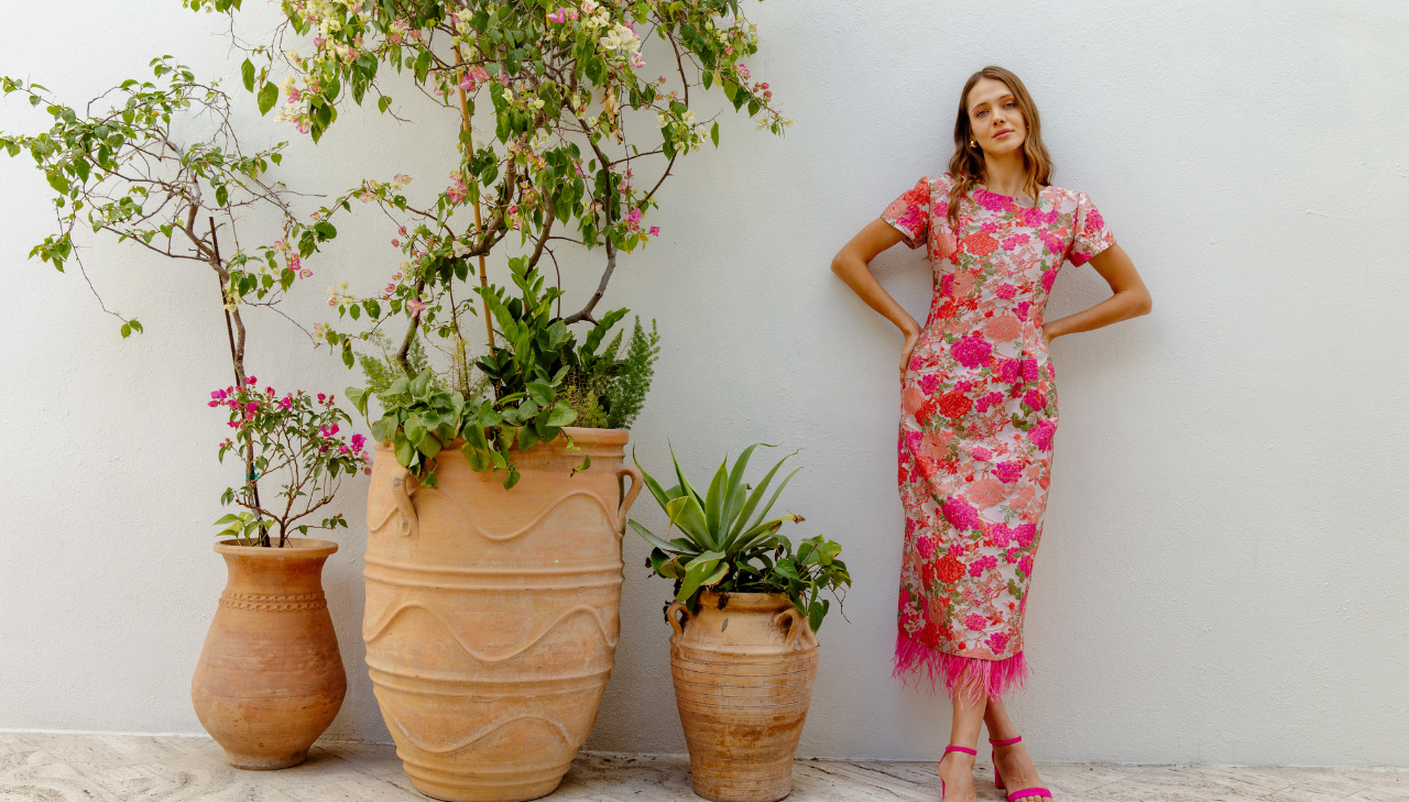 Girl leaning on wall in event dress
