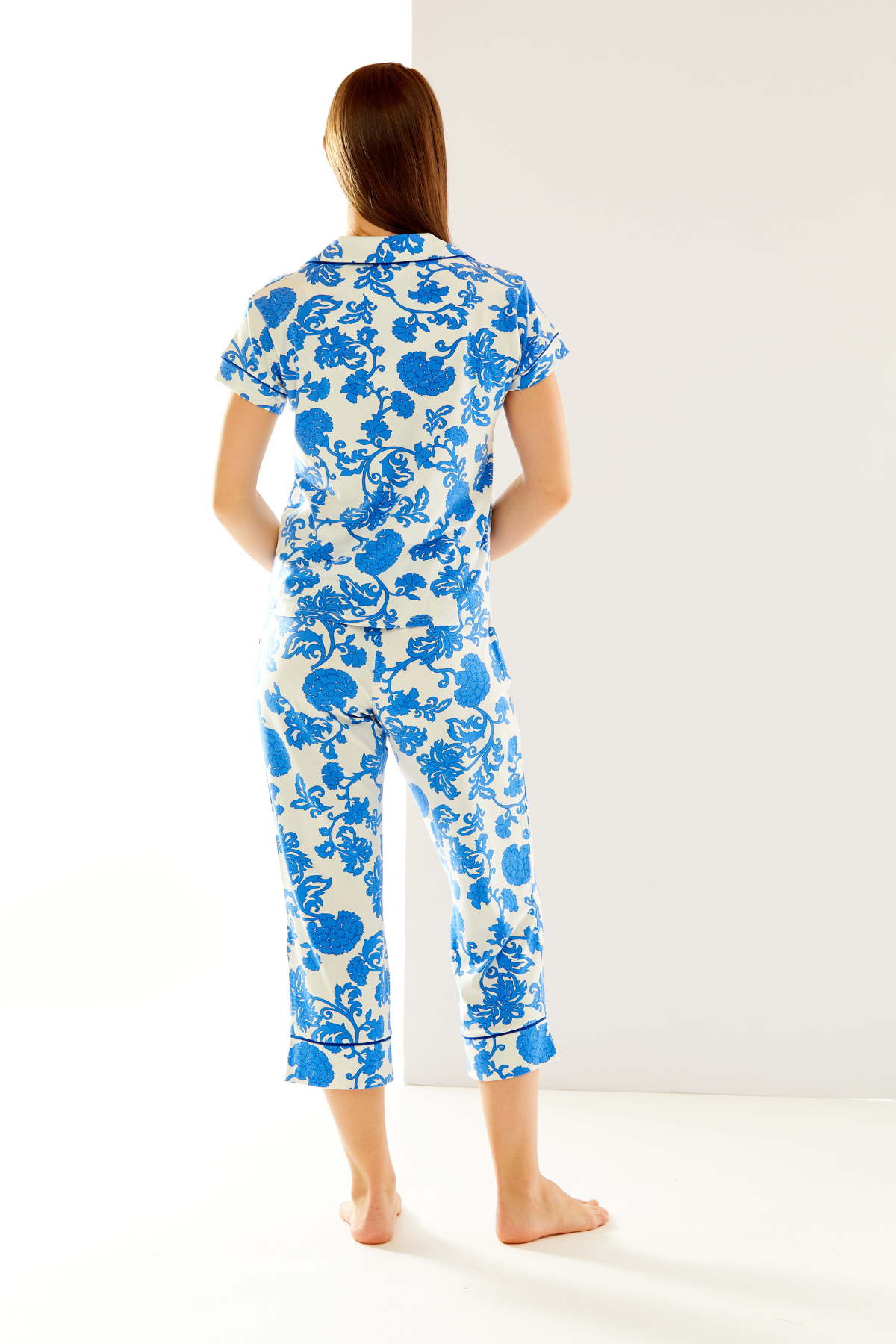 Woman in blue and white pajamas