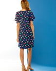 Woman in daisy print dress