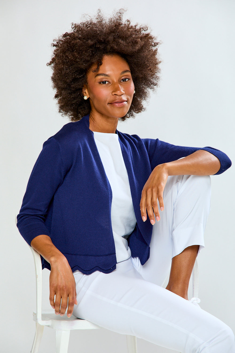 Woman wearing The New Scallop Cardigan - Navy