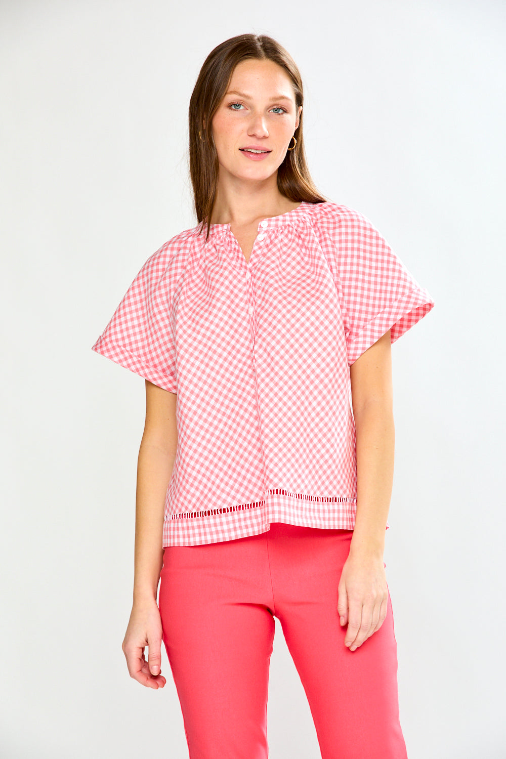 Woman in pink gingham top