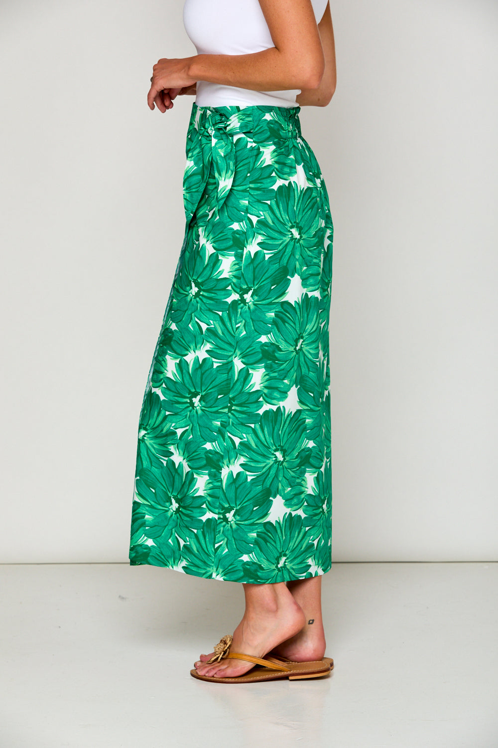 Woman in tropical print skirt