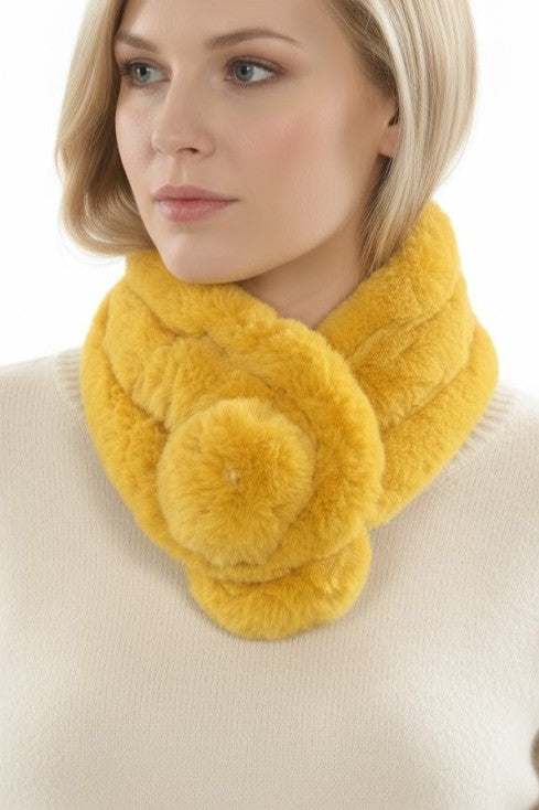Woman wearing a yellow fur scarf on a white background