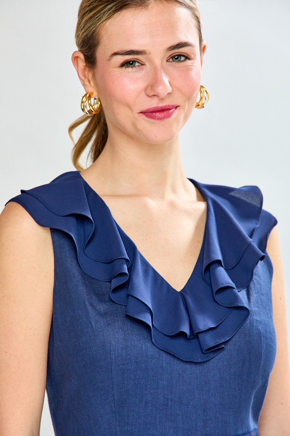 Woman in navy tea length dress