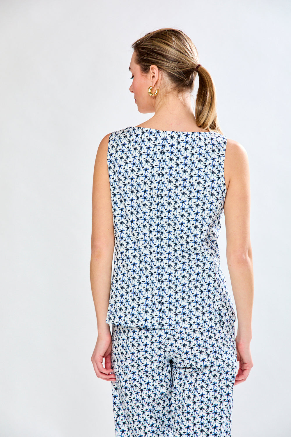 Woman in sleeveless shell top