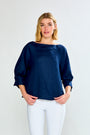 Woman wearing The Palermo Top in Linen in White