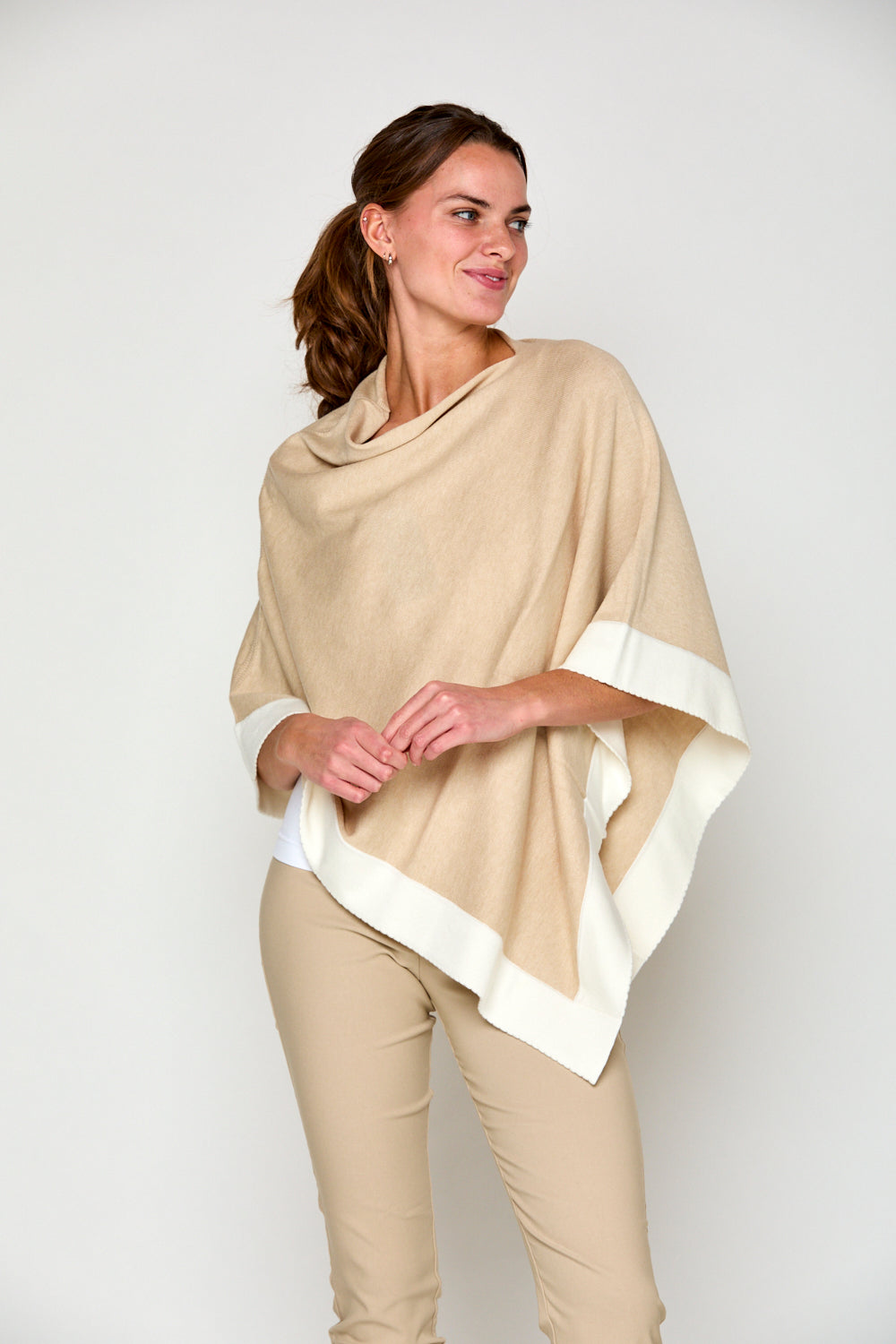 Woman in tipped poncho