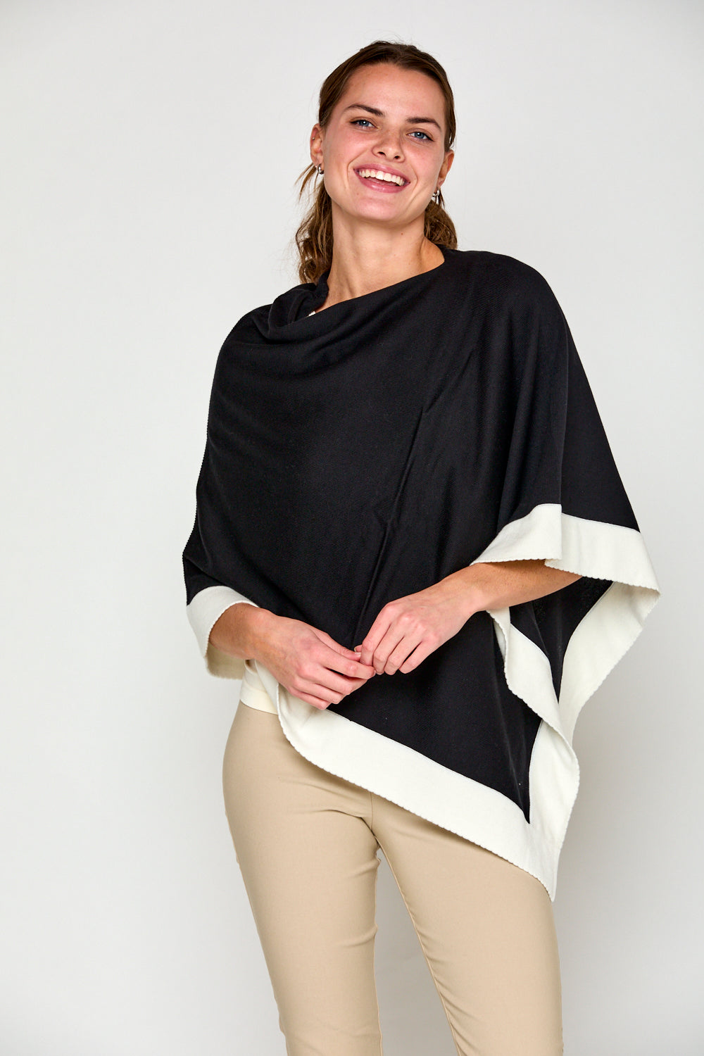 Woman in tipped poncho