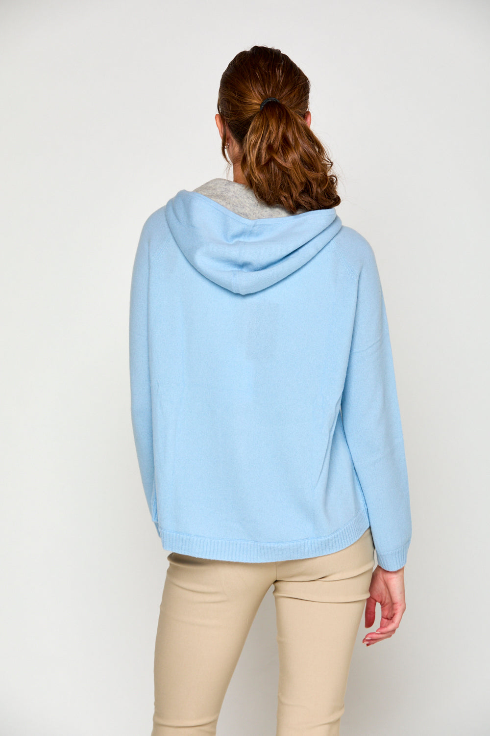 Woman in arctic cashmere hoodie