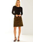 Woman in camel mini skirt with pockets