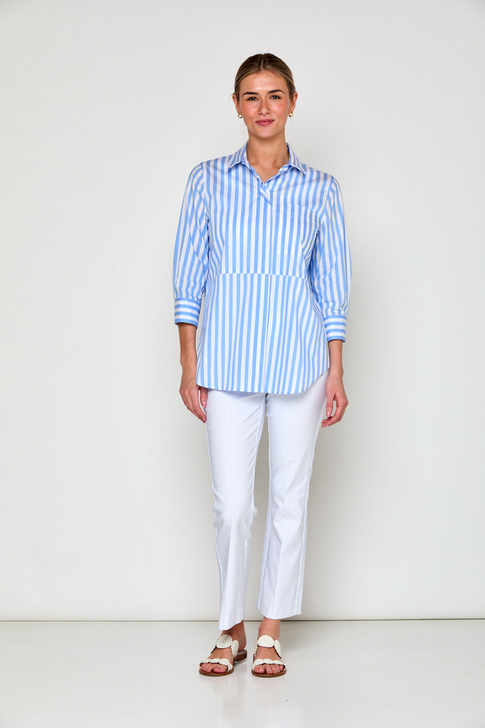 Woman in blue and white stripe blouse