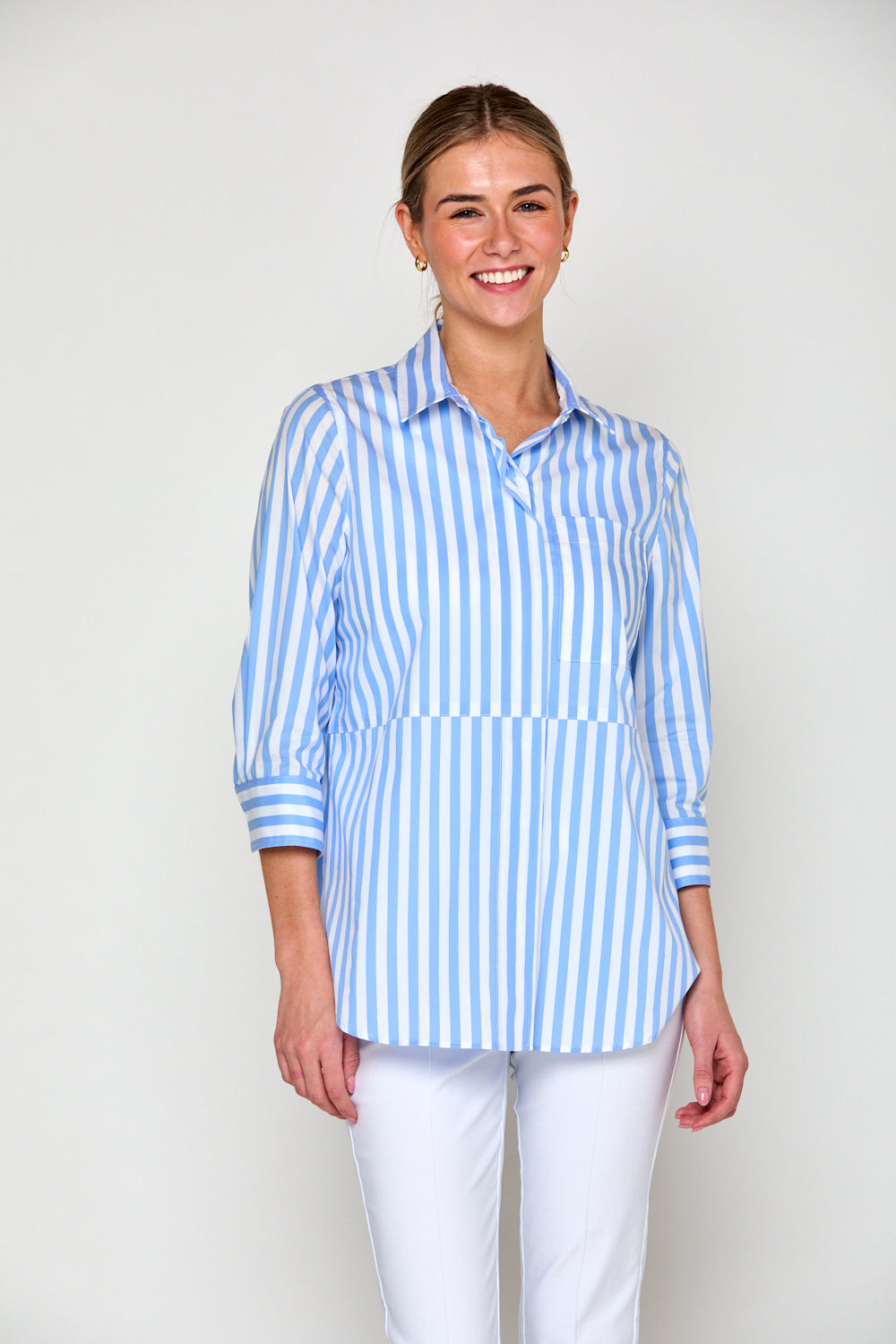 Woman in blue and white stripe blouse