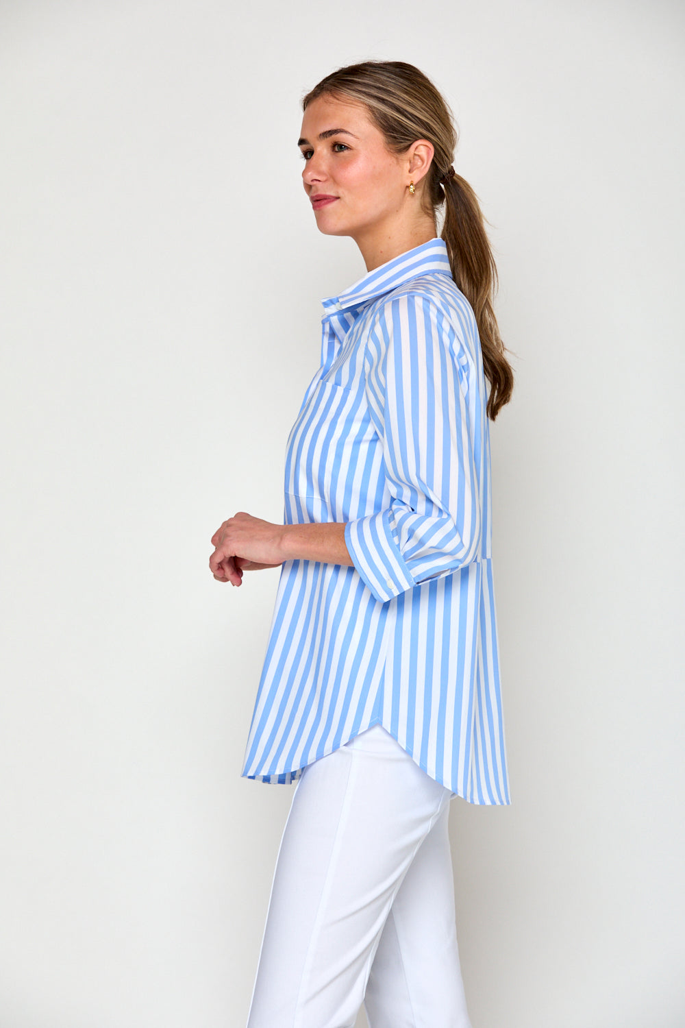 Woman in blue and white stripe blouse