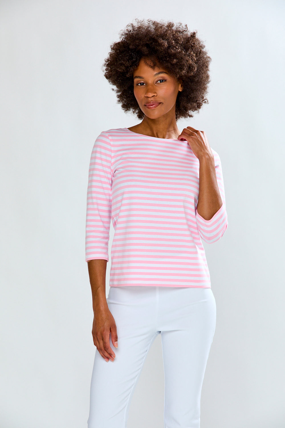 Woman in pink/white stripe knit top