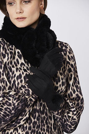 Woman in black faux suede faux fur gloves
