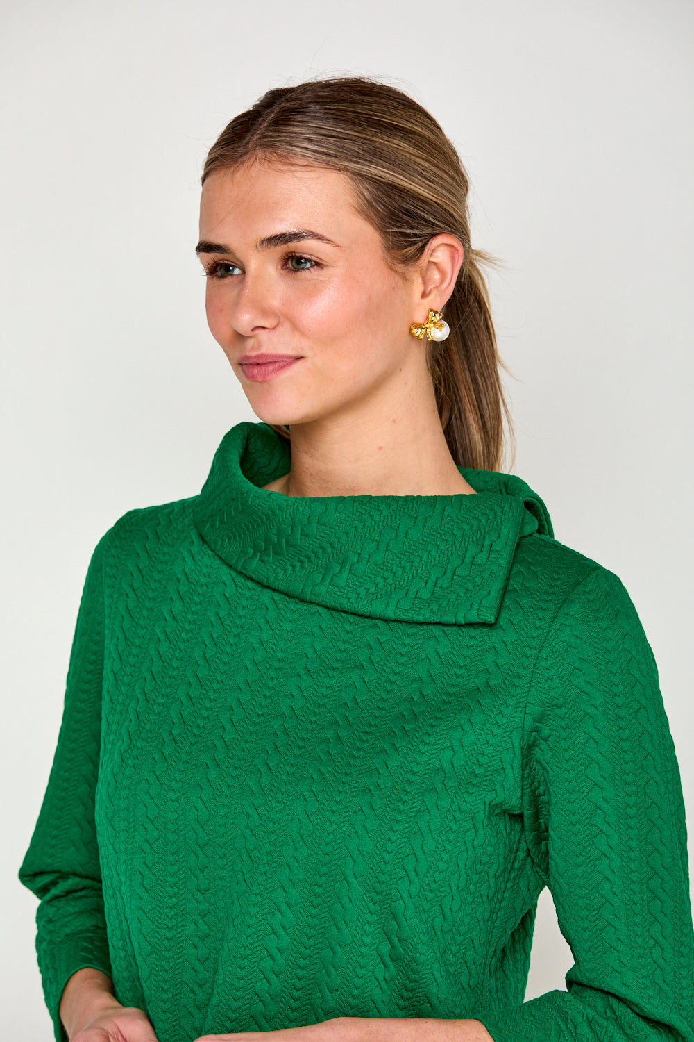 Woman in green cable top