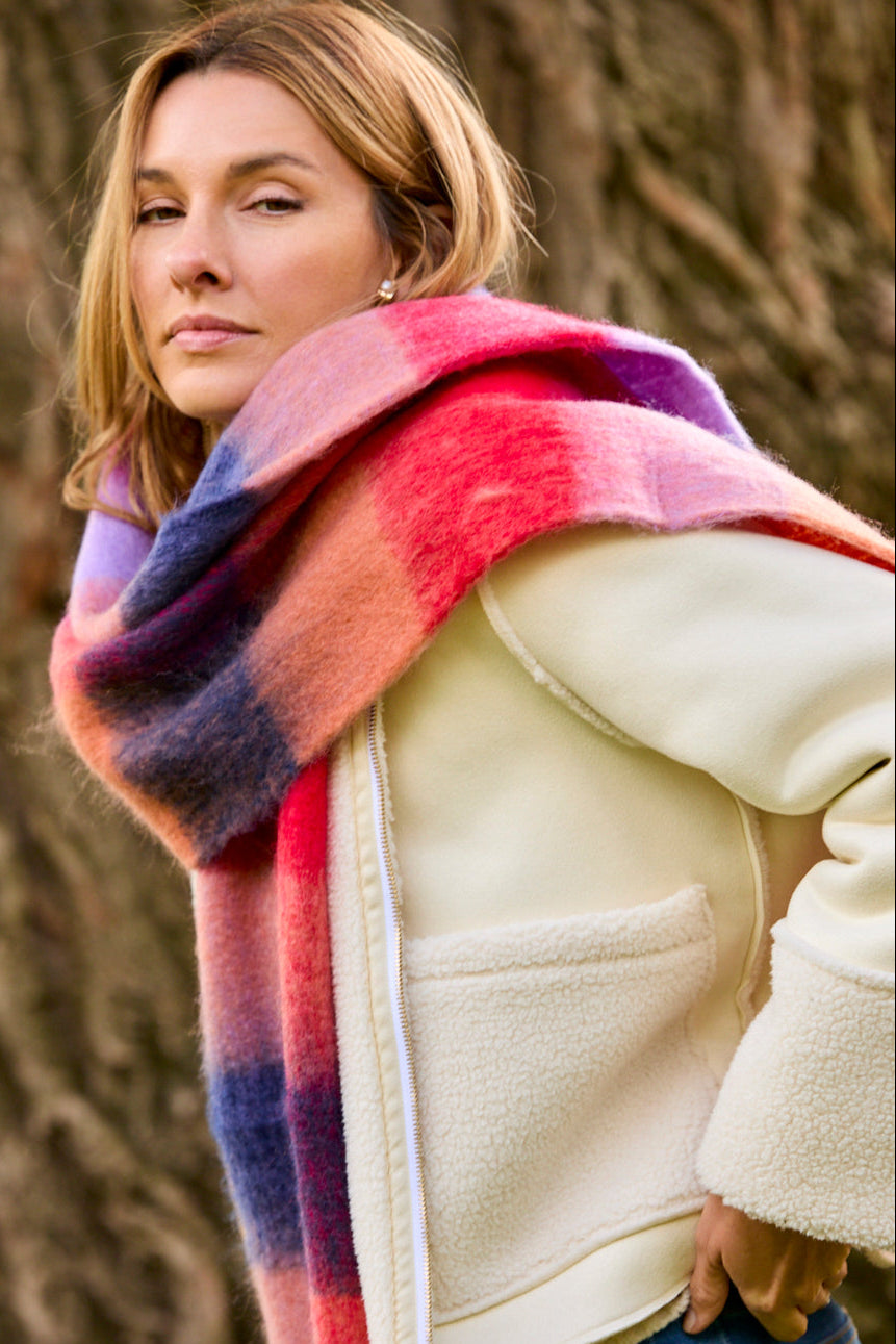 Woman wearing a colorful scarf