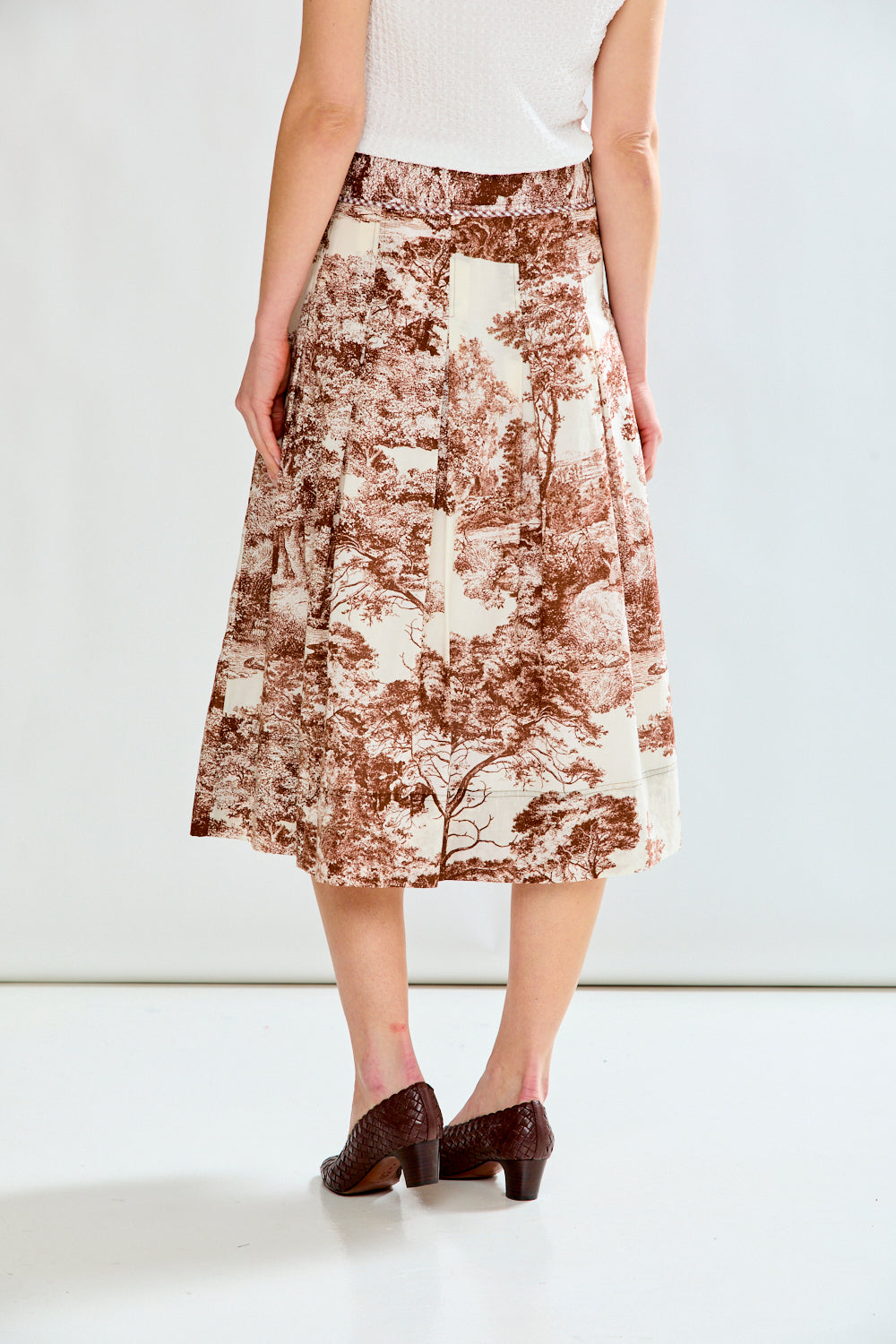 Woman in toile print skirt