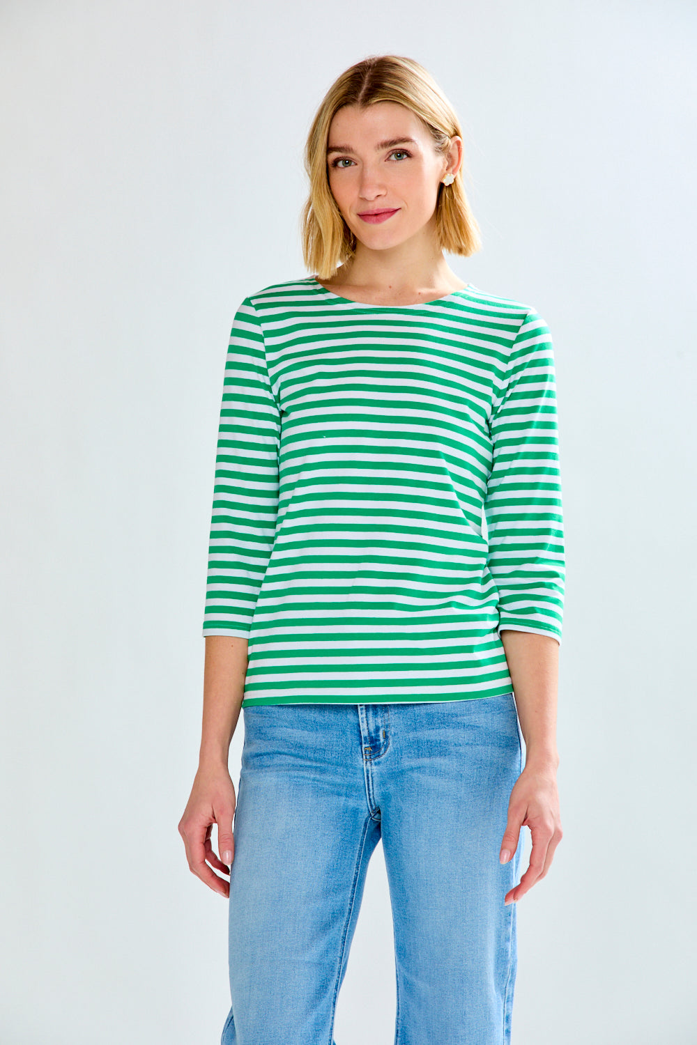 Woman in green/white stripe knit top