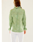 Woman in long sleeve green blouse