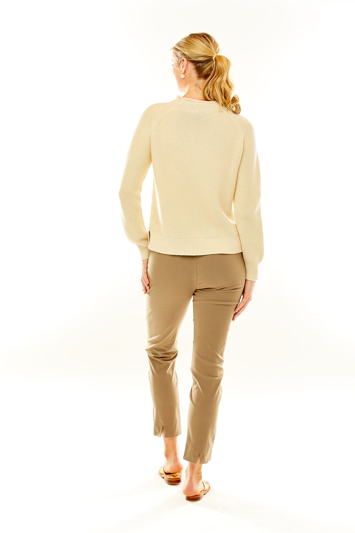 Woman in an ivory sweater