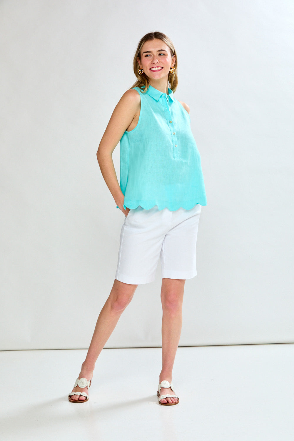 Woman in aero blue sleeveless blouse