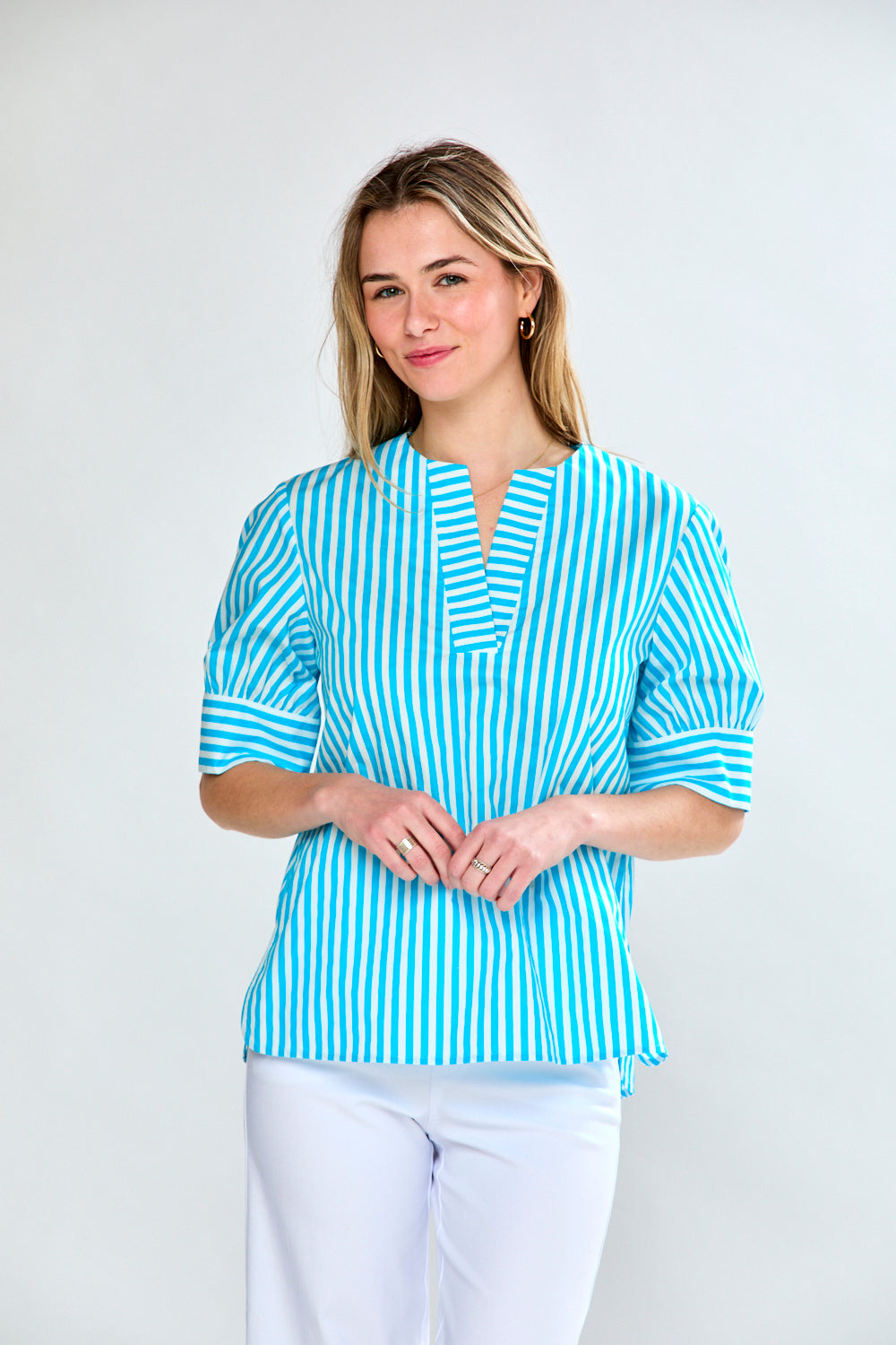 Woman in aqua stripe top
