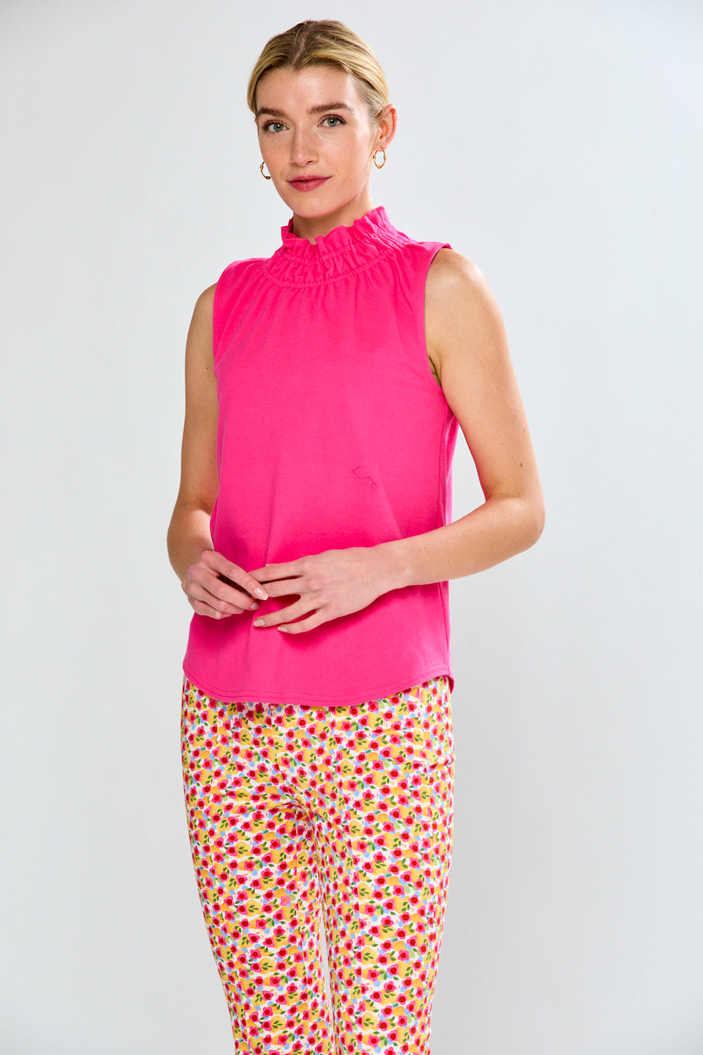 Woman in pink top and floral pants 