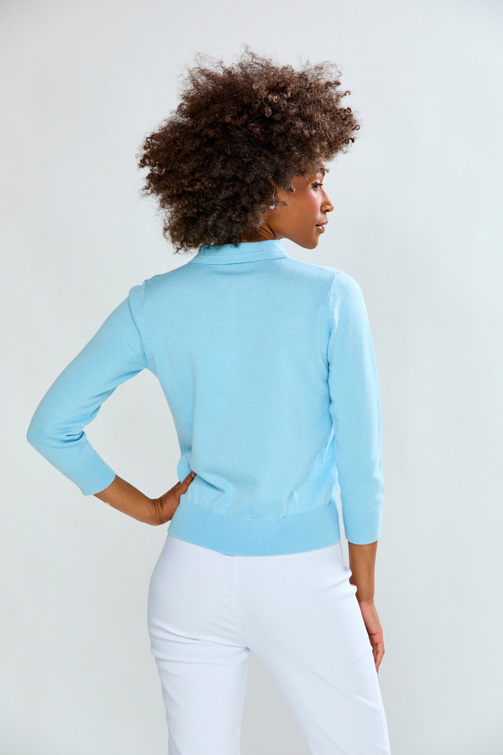 woman in light blue sweater