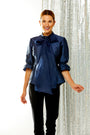 Woman in navy top with removable bow